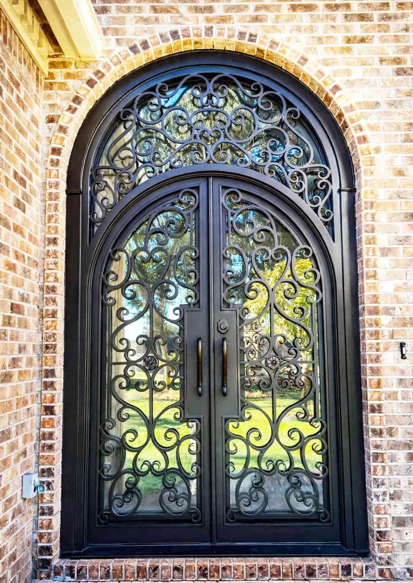 Double iron entry doors with transom — featured local project in Homewood, AL