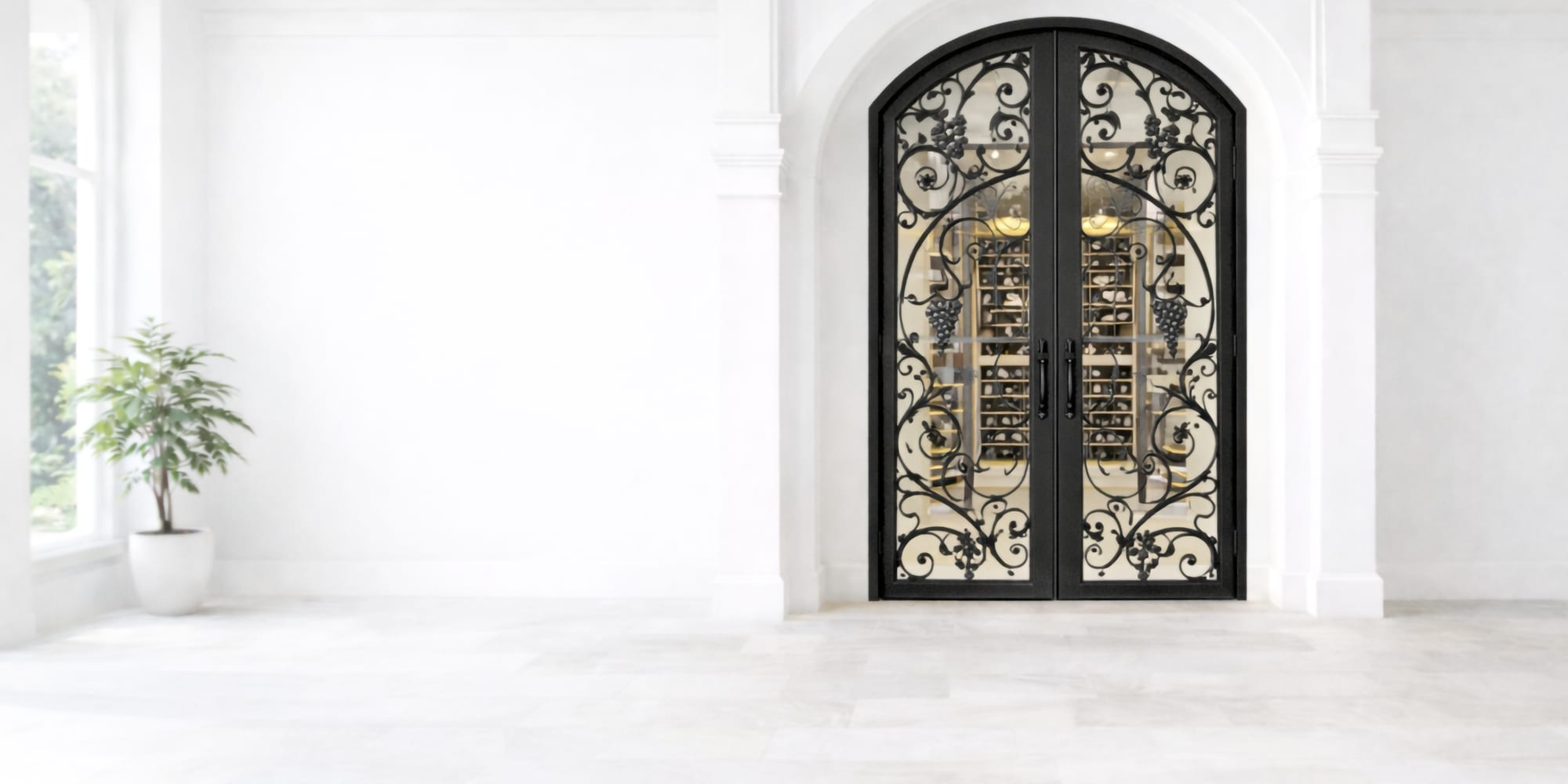 Arched wrought iron and glass entry door in a white plaster wall